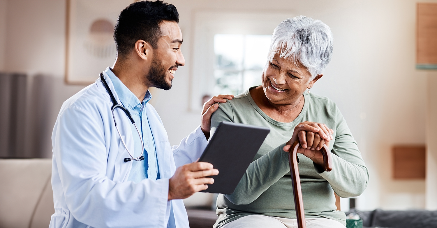 A doctor giving information to an elderly patient